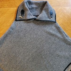 Poncho with faux leather trim